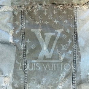 Denim jacket with semi-faded LV logo at back